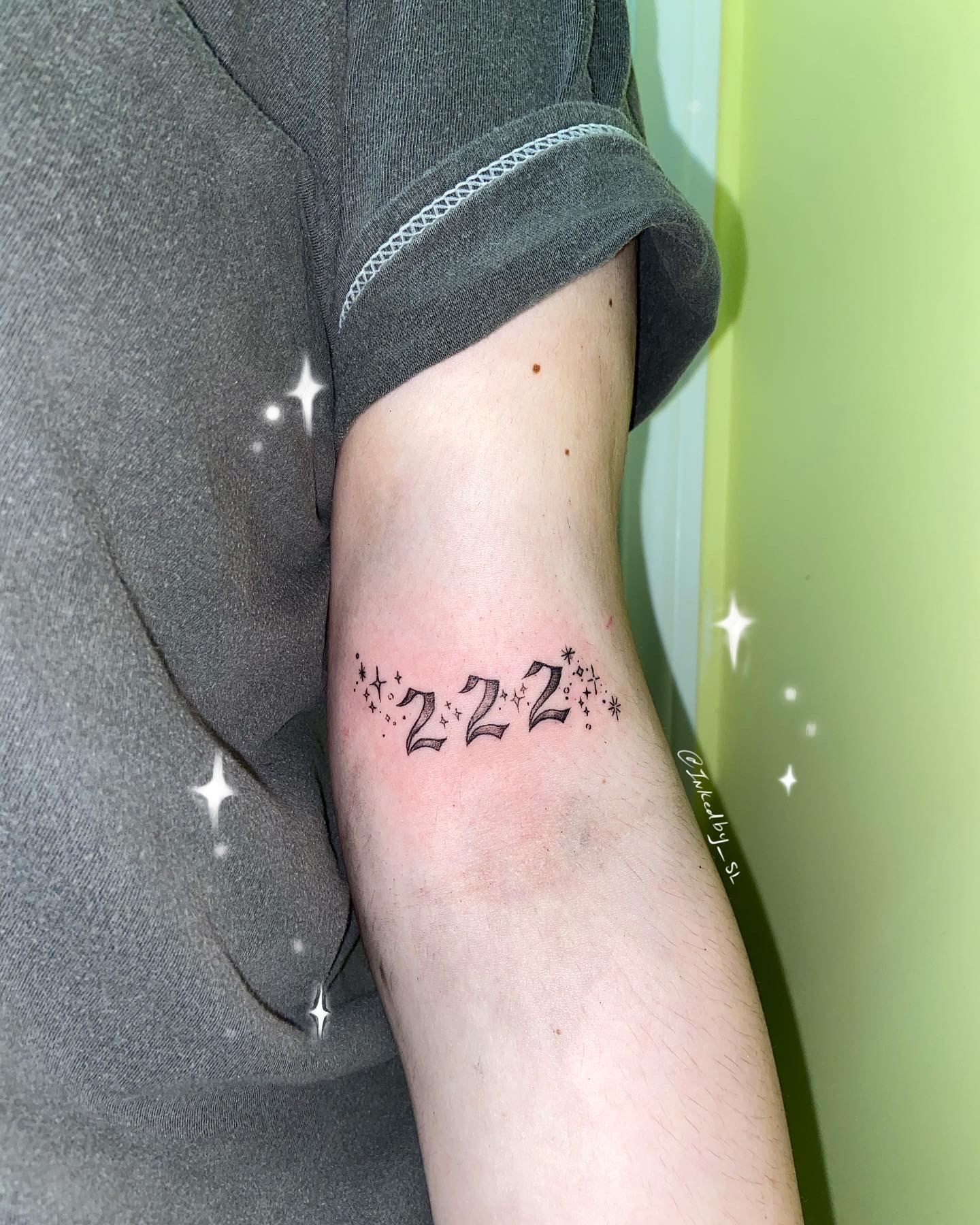 A client showing off the tattoos they received from Inked by SL.