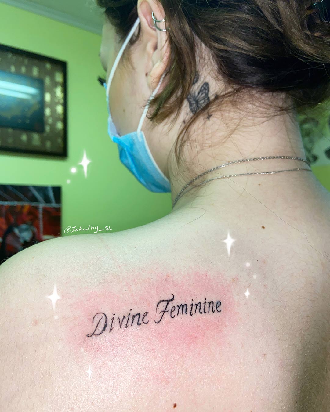 A client showing off the tattoos they received from Inked by SL.