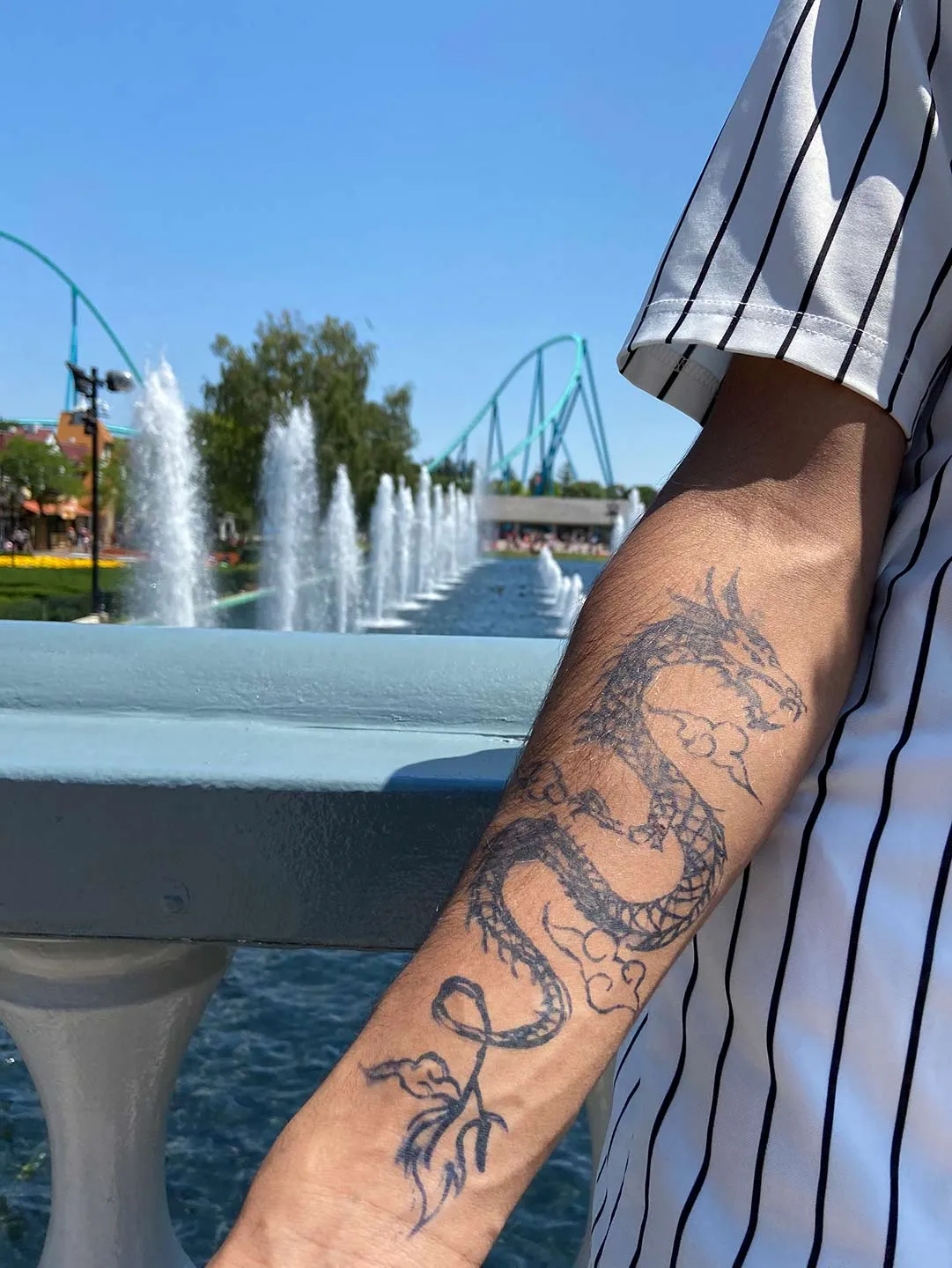 A client showing off the tattoos they received from Inked by SL.