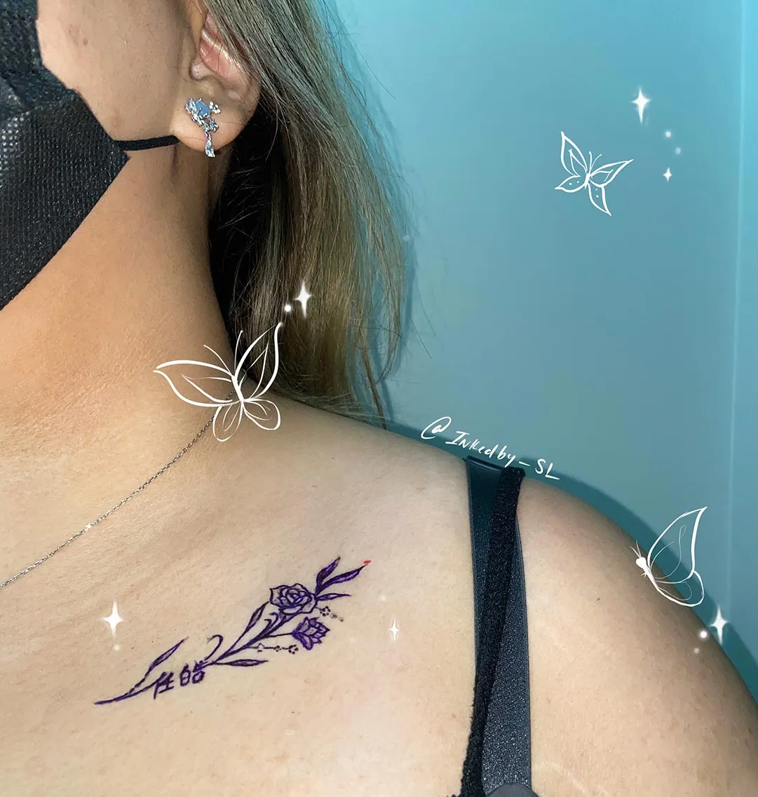 A client showing off the tattoos they received from Inked by SL.