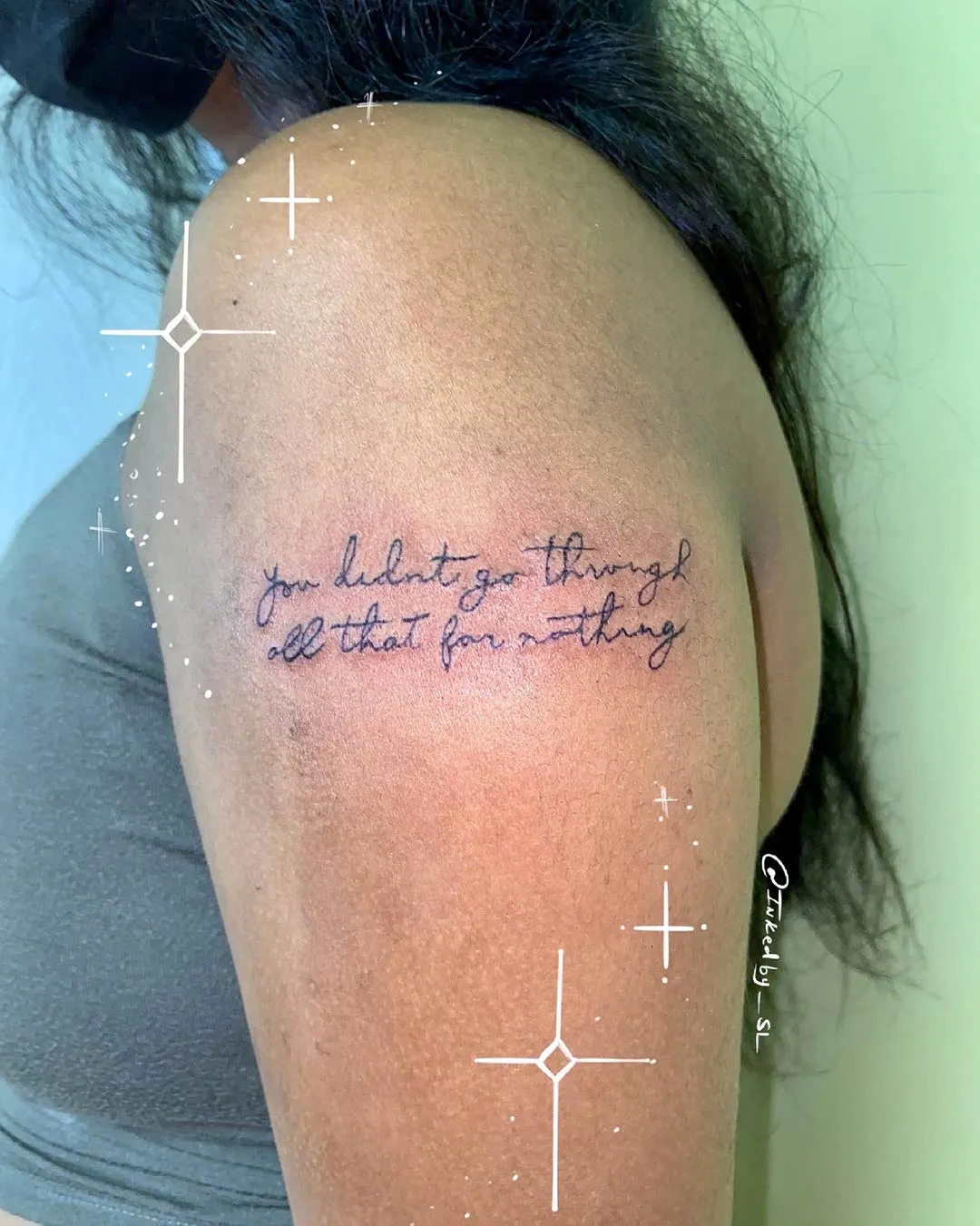 A client showing off the tattoos they received from Inked by SL.