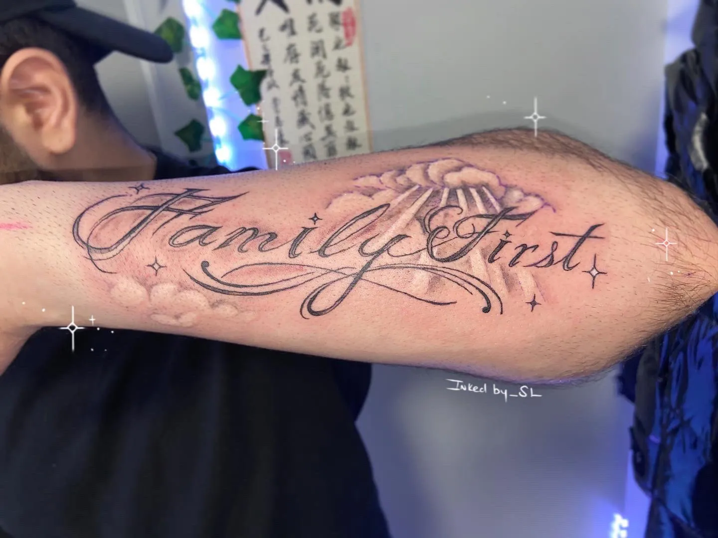 A client showing off the tattoos they received from Inked by SL.