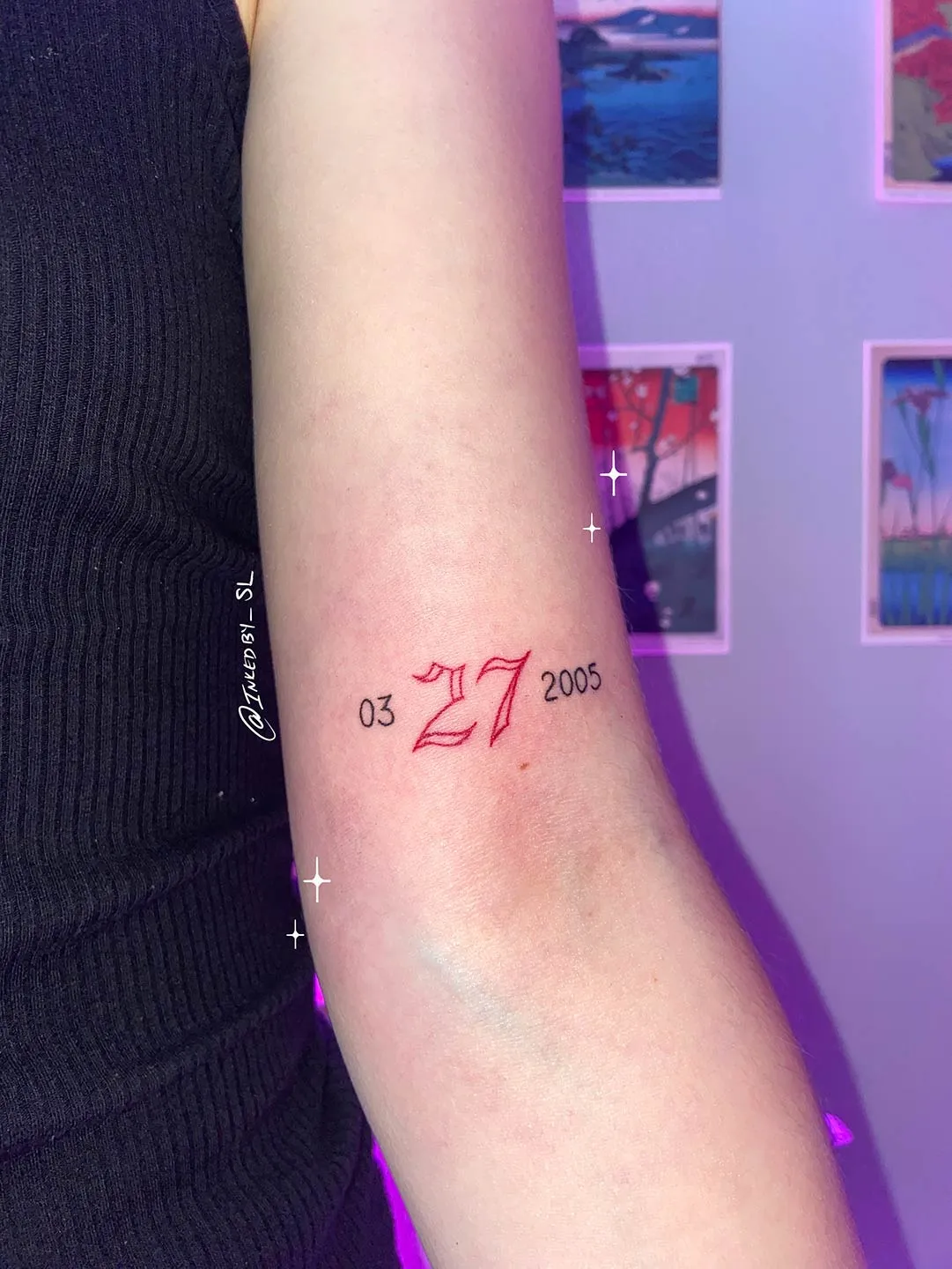 A client showing off the tattoos they received from Inked by SL.