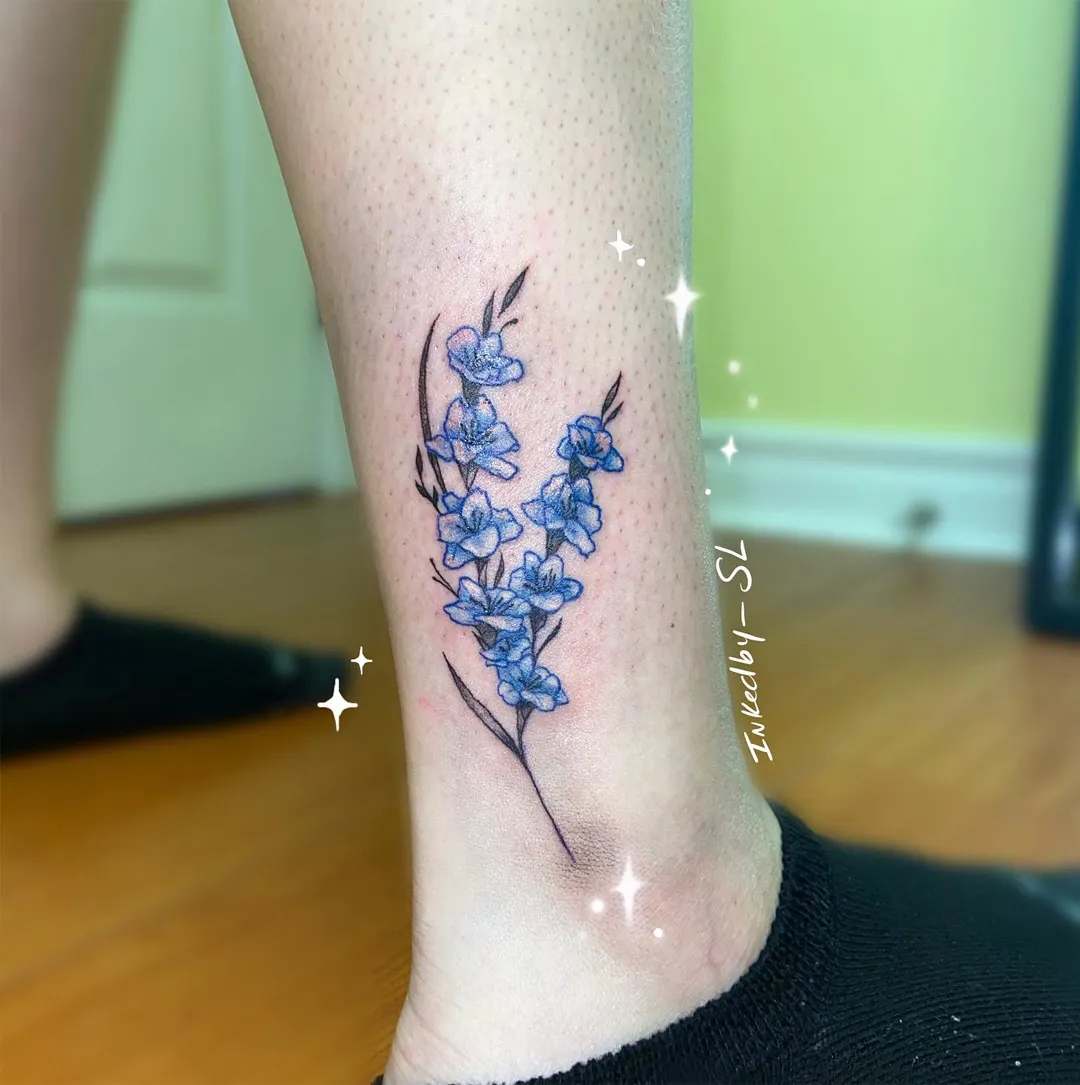 A client showing off the tattoos they received from Inked by SL.